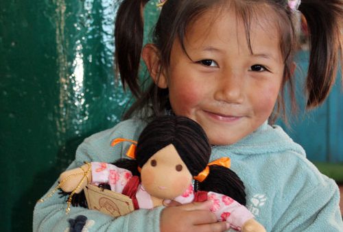 A school girl with a Tibetan friendship doll
